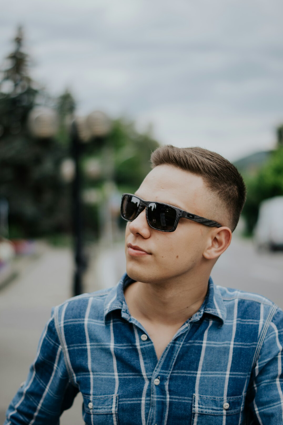 Portrait of a young man with short hair in a shirt
