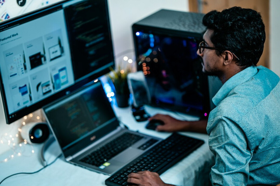 young programmer coding at desk